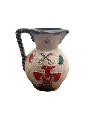 Vintage Kenmar pottery pitcher featuring a prominent red Thunderbird symbol.